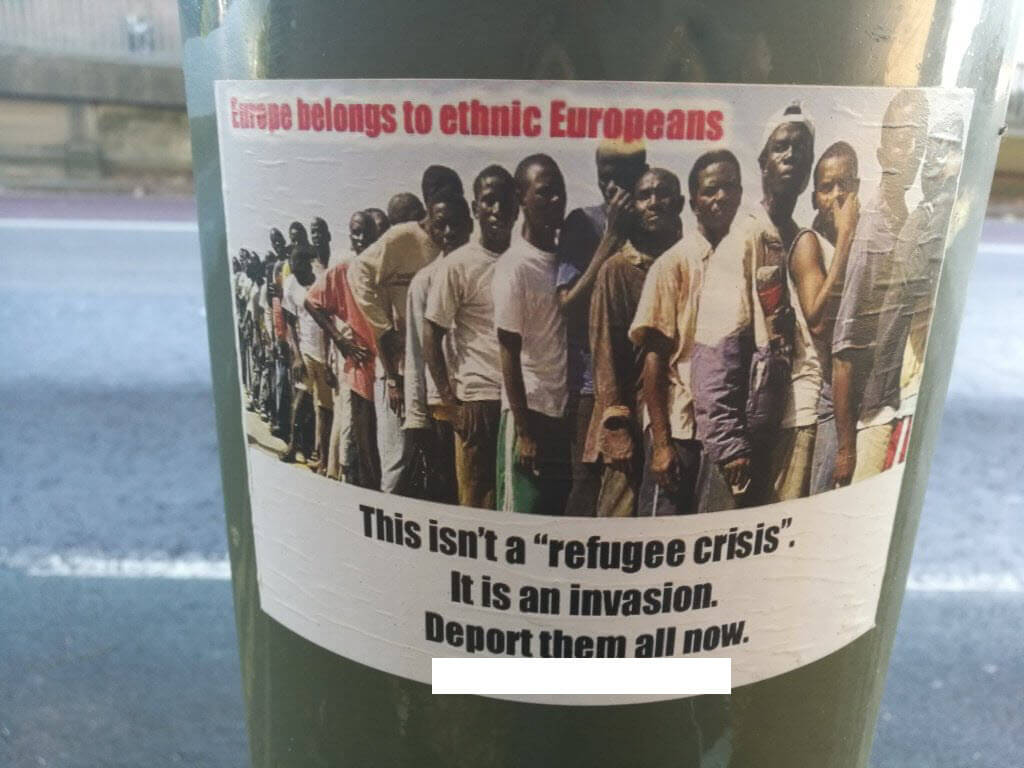 Stickers Playing on Themes of Mosques and Migrants appear on Lamp Posts