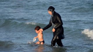 French official threatens to sue social media users who share burkini ban photos