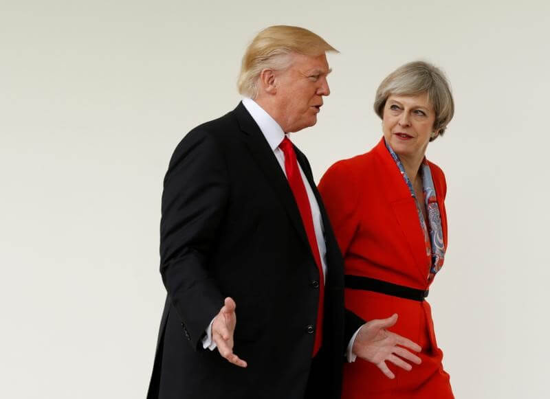 May says does not agree with Trump on immigration